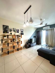 a living room with a couch and shelves at Saville Cheras 2 Bedroom HomeStay Link MRT in Cheras
