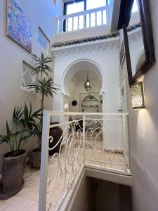 a staircase leading up to a building with a stair railing at A gem in the Medina of Essaouira in Essaouira