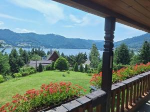 a view from the porch of a house with flowers at Montebello Colibita in Colibiţa