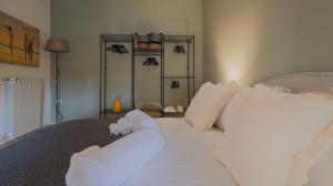 Postel nebo postele na pokoji v ubytování Lippi's House in Piazza Duomo + 24 fotografií