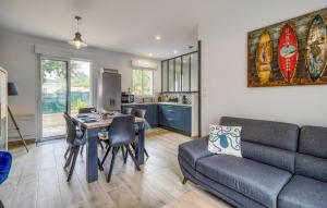 a living room with a couch and a table at 3 Bedroom Cozy Home In La Tremblade in La Tremblade