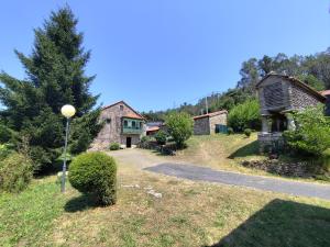 an estate with a house and a street light at Fogar dos Antigos in Mazaricos +43 photos