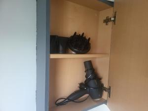 a black camera on a shelf in a room at Living Holiday in Middelkerke +46 photos