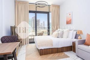 Postel nebo postele na pokoji v ubytování Bloomfields Cozy Stu in Al Maryah Island