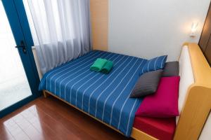 a bed with two pillows on it in a room at Velvet Vibe Chic Makati Stay Pool Gym 4034 in Manila