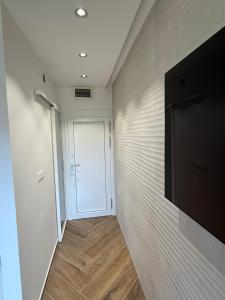 Televízia a/alebo spoločenská miestnosť v ubytovaní Casa Trussardi