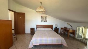 Letto o letti in una camera di Casetta a Cavarretta