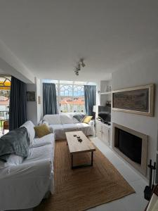 Χώρος καθιστικού στο Apartamento con terraza y vistas al mar en la Isla de la Toja