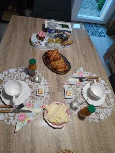 a table with plates of food on top of it at Monts repos! in Monts