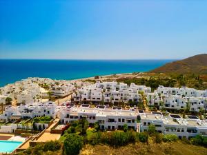 an aerial view of a resort with the ocean at Starfish Mojácar in Mojácar