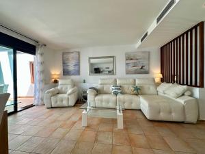 a living room with a couch and a table at Starfish Mojácar in Mojácar +51 photos