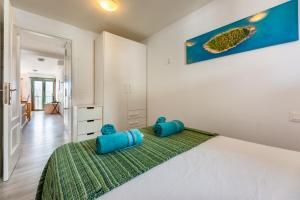 A bed or beds in a room at Casa Esmeralda