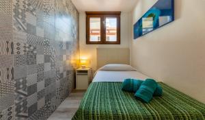 A bed or beds in a room at Casa Esmeralda