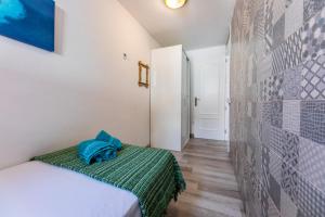 A bed or beds in a room at Casa Esmeralda