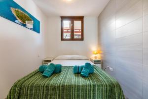 A bed or beds in a room at Casa Esmeralda