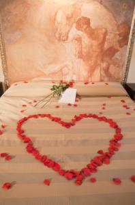 Postel nebo postele na pokoji v ubytování Albergo Sant'Emidio