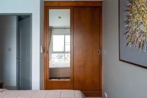 Postel nebo postele na pokoji v ubytování Mae Phim Grand Blue Condo with pool and seaview + 25 fotografií