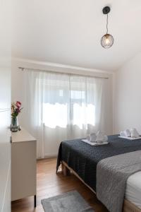 Ένα ή περισσότερα κρεβάτια σε δωμάτιο στο Apartman Tarja
