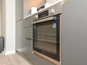 a stainless steel oven in a kitchen at Amazing Views in Central Leeds - Pass The Keys in Leeds