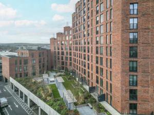 an aerial view of a city with tall brick buildings at Amazing Views in Central Leeds - Pass The Keys in Leeds