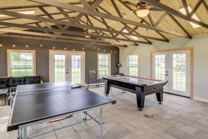 a large room with a ping pong table in it at Dry Ridge Rental Home with Hot Tub and Game Room! in Dry Ridge