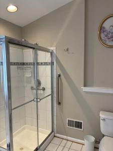 a bathroom with a shower and a toilet at Maple Lawn Gem -sunny townhouse 3 bedrooms in Laurel +50 photos