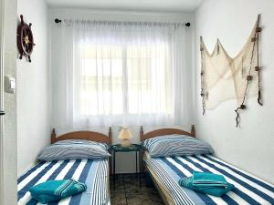 Postel nebo postele na pokoji v ubytování Pool & Sea Apartment