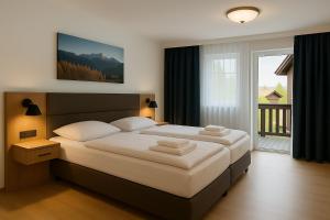 Postel nebo postele na pokoji v ubytování A8 Hotel im Darchinger Hof Bed & Breakfast - Zwischen Holzkirchen und Weyarn - Zwischen München Salzburg und Innsbruck - Kurz vor dem Irschenberg