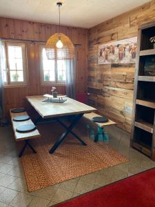 a dining room with a table and two chairs at Séjour Edelweiss in Arolla +15 photos