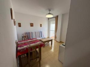 a living room with a table and a couch at Spacious Apartment in Barbate - Terrace with Sea View in Barbate +33 photos