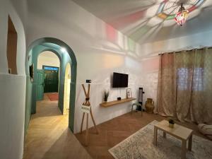 a living room with a tv on a ceiling at Big Apartment in Central Medina 3BR ,view and Jacuzzi Tetouan in Tetouan