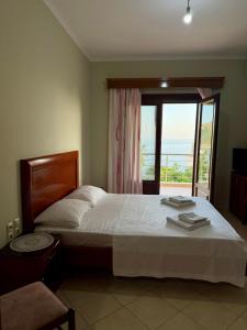 Postel nebo postele na pokoji v ubytování Mitro Guesthouse