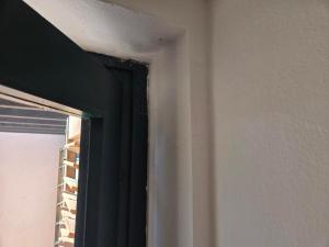 a corner of a room with a window at zaton in Razvala