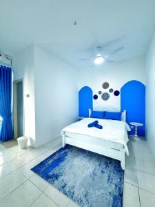 Letto o letti in una camera di Santorini Vibes Penang - Tasek Gelugor