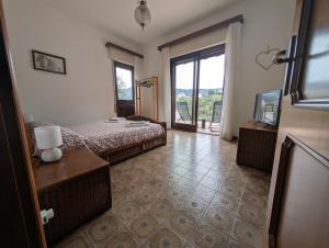 Ένα ή περισσότερα κρεβάτια σε δωμάτιο στο La casa di nonna Lorenna