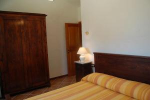 Ένα ή περισσότερα κρεβάτια σε δωμάτιο στο Rustico in campagna a pochi minuti dal mare