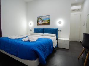 Postel nebo postele na pokoji v ubytování Amuri Room&Suite