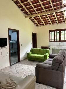 a living room with two couches and a green couch at CHÁCARA recanto das nuvens 2 in Arujá +18 photos