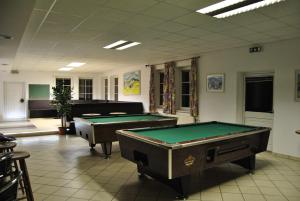 a billiard room with two pool tables in it at Gasthof und Pension Haunschmid in Rechberg