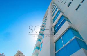 a tall building with the word sooc on it at Apartamentos Neos - Cerca al Mar by SOHO in Santa Marta