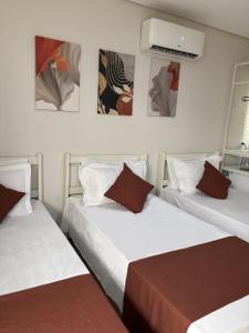 Cama ou camas em um quarto em Sr Hotel