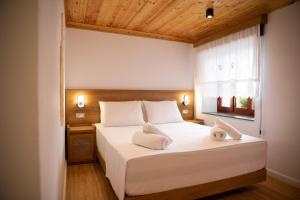 Postel nebo postele na pokoji v ubytování Guesthouse Lani