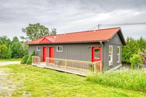 a small house with a red roof at 201 Cabins in Jackman