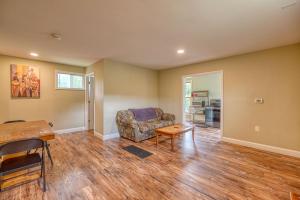 a living room with a couch and a table at 201 Cabins in Jackman +9 photos