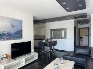 a living room with a large flat screen tv at Apartment Villa Marjanovic in Opatija