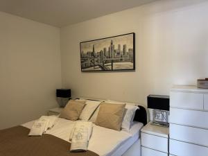 a bedroom with a bed and a painting on the wall at Apartment Villa Marjanovic in Opatija +25 photos