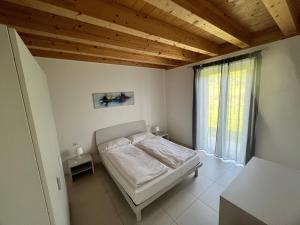 Posteľ alebo postele v izbe v ubytovaní Val Mora Bio Apartments + 37 fotografií