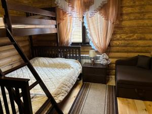 a bedroom with a bunk bed and a window at Woodhouse Svitiaz in Svityazʼ