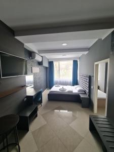 Postel nebo postele na pokoji v ubytování Hotel Fama