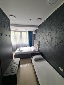 Postel nebo postele na pokoji v ubytování Hotel Fama